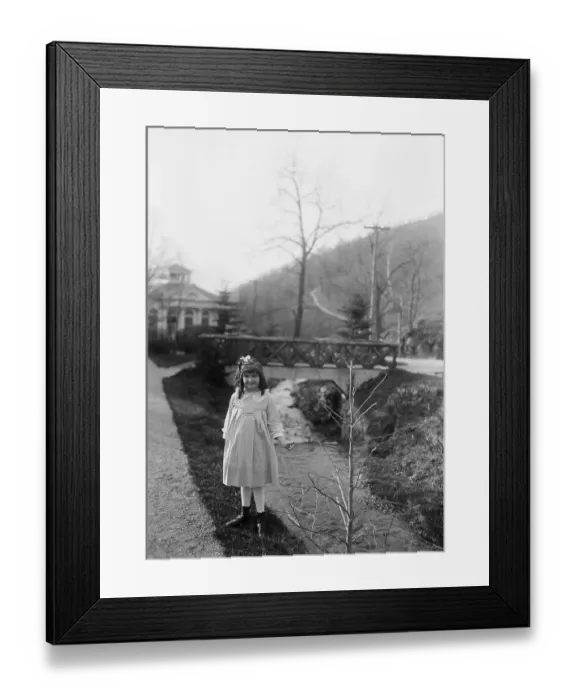 Framed Print : Portrait of young girl (8-9 years) holding tree branch by stream. April 14, 1922 Framed Print : Portrait of young girl (8-9 years) holding tree branch by stream. April 14, 1922