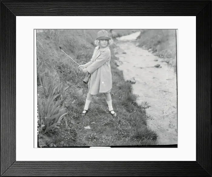 Framed Print : Girl Swinging a Golf Club Framed Print : Girl Swinging a Golf Club