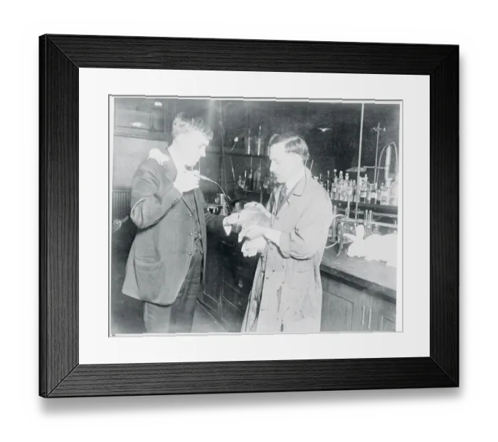 Framed Print : Man Administering Moonshine to a Rabbit Framed Print : Man Administering Moonshine to a Rabbit