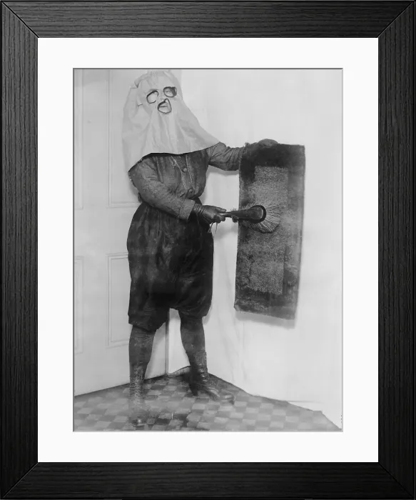 Framed Print : Housewife Wearing Hood While Dusting Framed Print : Housewife Wearing Hood While Dusting