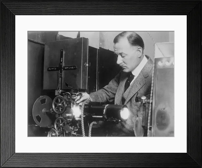 Framed Print : Inventor Testing Cold Light with Film Framed Print : Inventor Testing Cold Light with Film