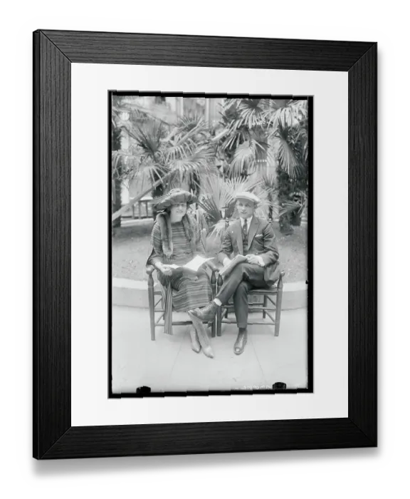 Framed Print : Couple During Giants Gathering Posing in Chairs Framed Print : Couple During Giants Gathering Posing in Chairs