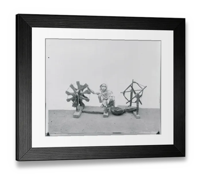 Framed Print : Young Child Using Charka to Weave Framed Print : Young Child Using Charka to Weave