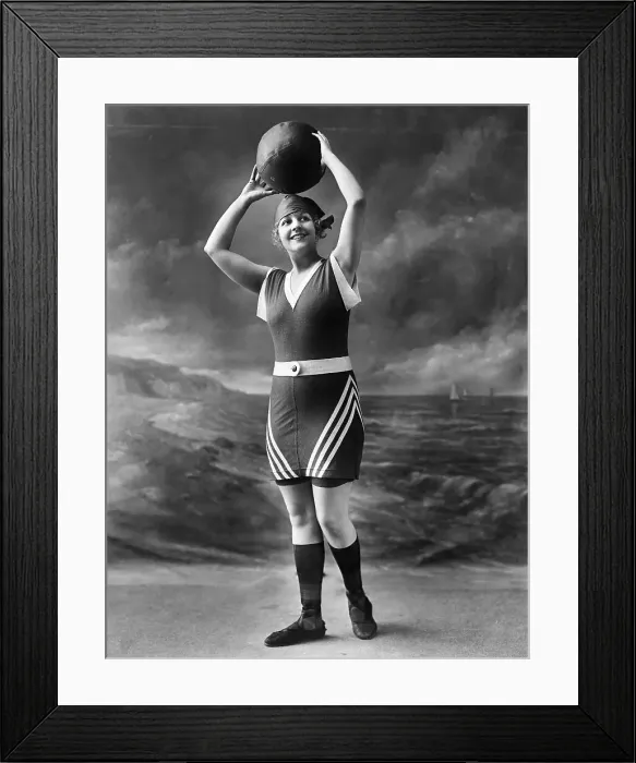 Framed Print : Woman in Swimsuit Holding Ball Framed Print : Woman in Swimsuit Holding Ball