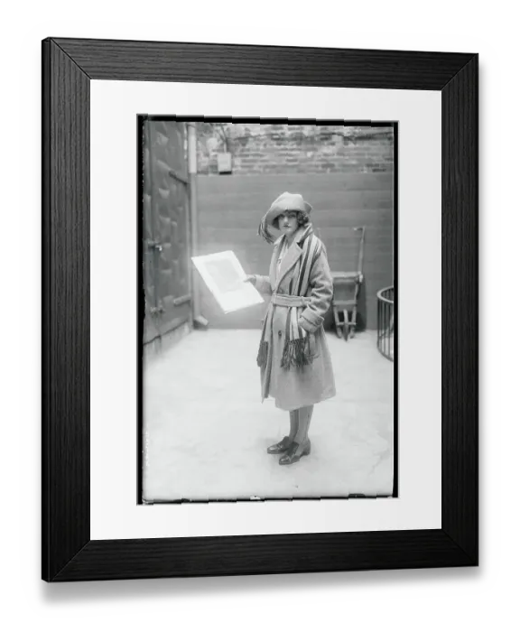 Framed Print : Girl Holding a Photograph Framed Print : Girl Holding a Photograph