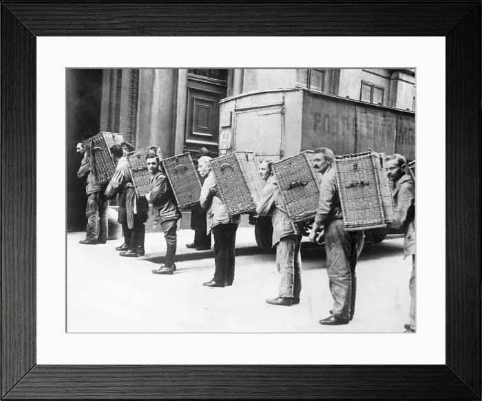 Framed Print : Men Carrying Baskets of Money Framed Print : Men Carrying Baskets of Money