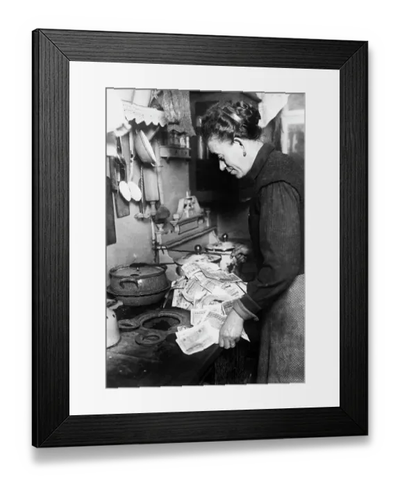 Framed Print : Woman Using Paper Money to Light Stove Framed Print : Woman Using Paper Money to Light Stove