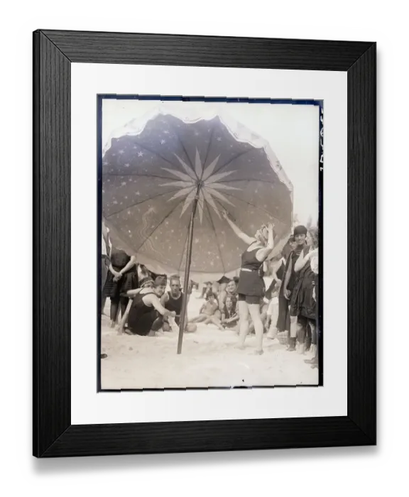 Framed Print : Lady Stands Under Huge Beach Umbrella Framed Print : Lady Stands Under Huge Beach Umbrella