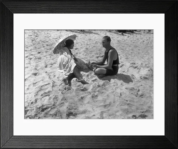 Framed Print : Couple sitting on beach Palm Beach, Florida, USA. March 18, 1921 Framed Print : Couple sitting on beach Palm Beach, Florida, USA. March 18, 1921