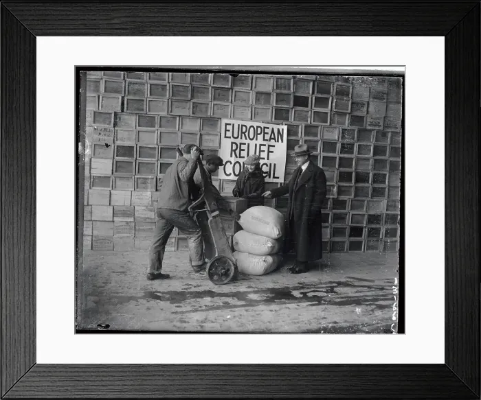 Framed Print : Herbert Hoover Standing with Man Loading Bags of Food Framed Print : Herbert Hoover Standing with Man Loading Bags of Food