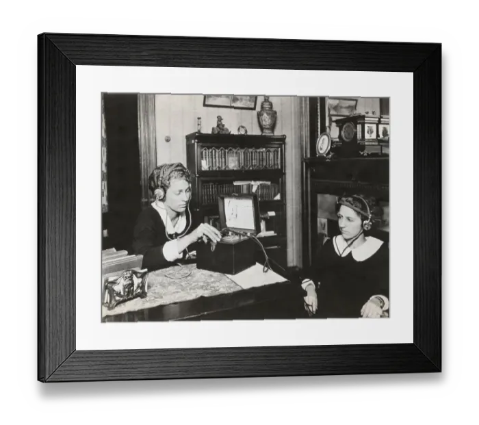 Framed Print : Women Listening to Receiver Framed Print : Women Listening to Receiver