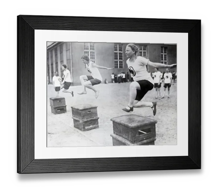 Framed Print : Young Women Hurdling Over Low Obstacles Framed Print : Young Women Hurdling Over Low Obstacles