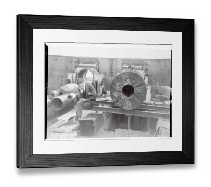 Framed Print : Worker Examining a Gun at Heligoland Island Framed Print : Worker Examining a Gun at Heligoland Island