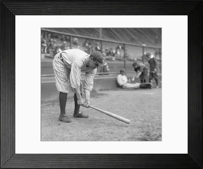 Framed Print : Babe Ruth tapping baseball bat on the ground