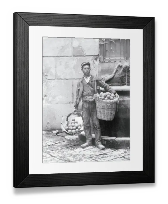 Framed Print : Man Carrying Produce for Sale Framed Print : Man Carrying Produce for Sale