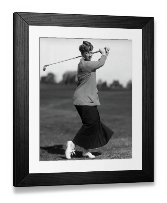Framed Print : Woman Swinging a Golf Club