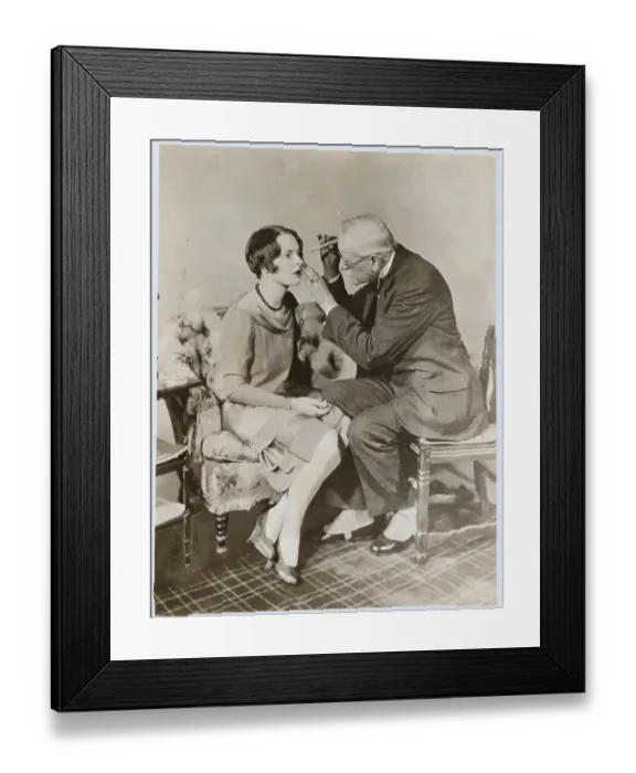 Framed Print : Physician Using Early Technique to Examine Female's Eyes Framed Print : Physician Using Early Technique to Examine Female's Eyes