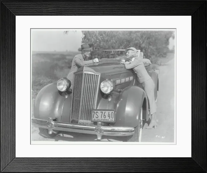 Framed Print : Couple Leaning on Automobile Framed Print : Couple Leaning on Automobile