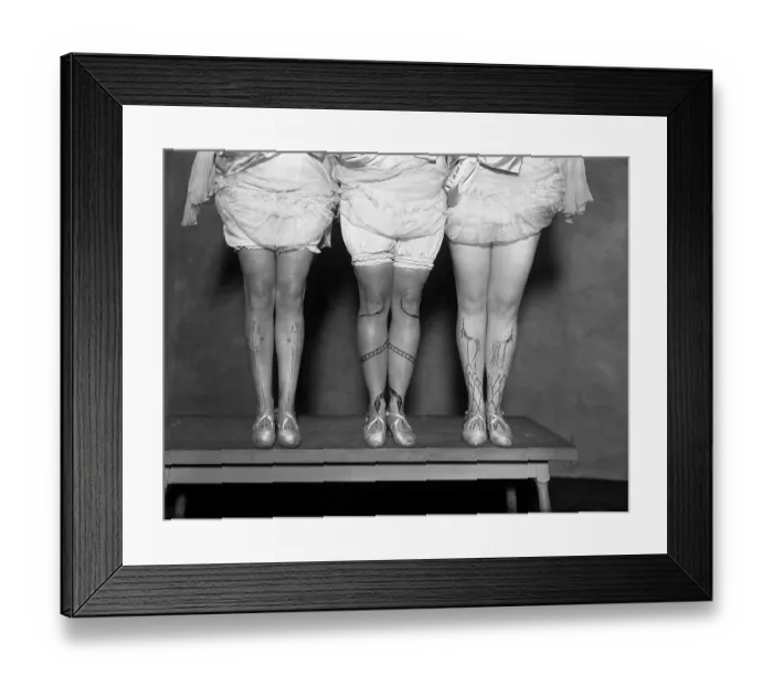 Framed Print : Low section of women with decoration on legs Framed Print : Low section of women with decoration on legs