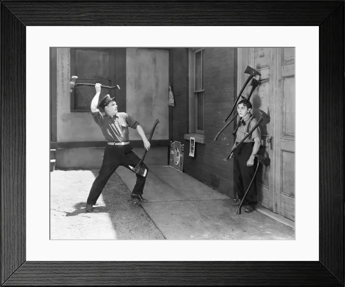 Framed Print : Men Performing Ax Throwing Stunt