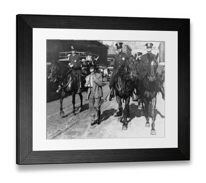 Framed Print : Mounted Police Escorting Man on Street Framed Print : Mounted Police Escorting Man on Street