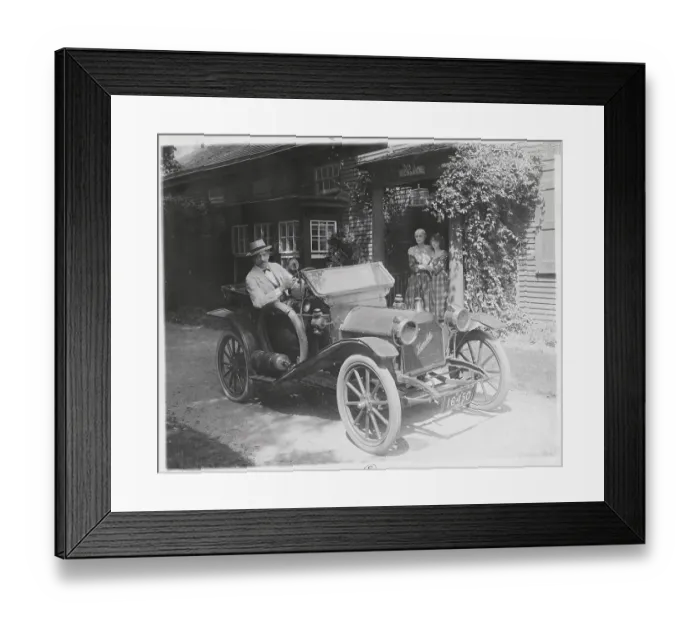Framed Print : Man in Old-Fashioned Car