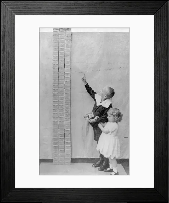 Framed Print : Small Boy and Girl Gazing up at Pile of Marks Framed Print : Small Boy and Girl Gazing up at Pile of Marks