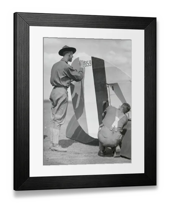 Framed Print : Men Attaching Rudder to Plane Framed Print : Men Attaching Rudder to Plane