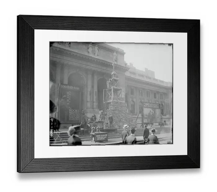 Framed Print : Tower of Books Piled Outside of Library Framed Print : Tower of Books Piled Outside of Library