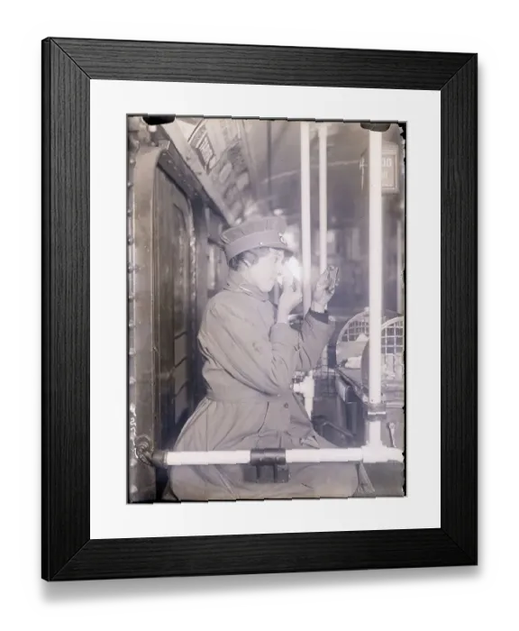 Framed Print : Conductorette Powdering Her Nose Framed Print : Conductorette Powdering Her Nose