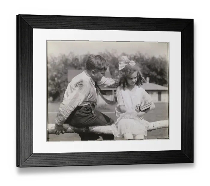 Framed Print : Little Boy Sitting with Girl Framed Print : Little Boy Sitting with Girl