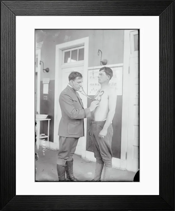 Framed Print : Doctor Examining Soldier on Base Framed Print : Doctor Examining Soldier on Base