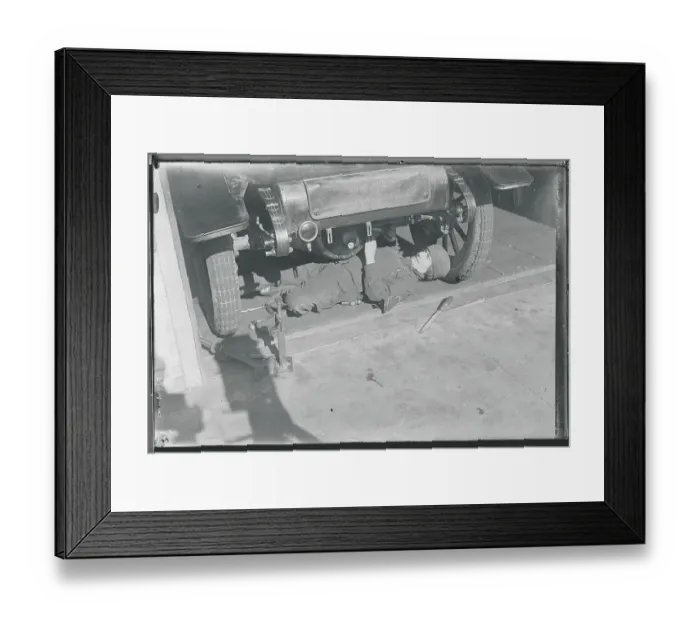 Framed Print : Woman Machinist Under Car Framed Print : Woman Machinist Under Car