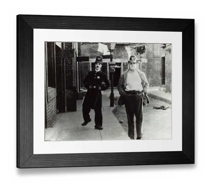 Framed Print : Charlie Chaplin (Left) in Police Uniform Framed Print : Charlie Chaplin (Left) in Police Uniform