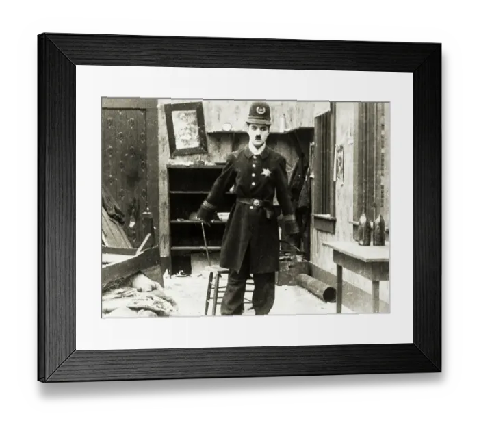 Framed Print : Charlie Chaplin in Police Uniform Framed Print : Charlie Chaplin in Police Uniform