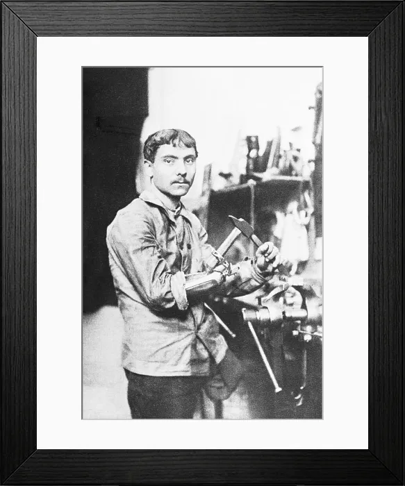 Framed Print : War Veteran Hammering with Artificial Limb