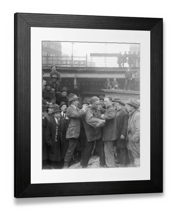 Framed Print : Men Helping Houdini into Straitjacket Framed Print : Men Helping Houdini into Straitjacket