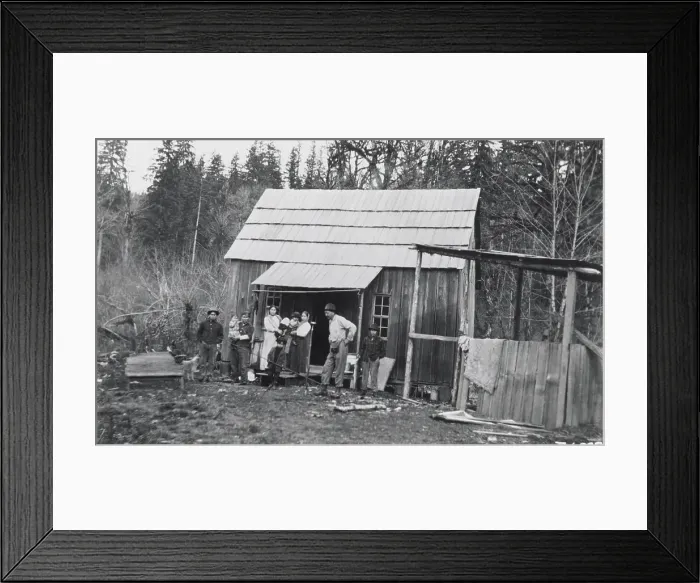 Framed Print : Indian Logger Stands In Front Of Home Framed Print : Indian Logger Stands In Front Of Home