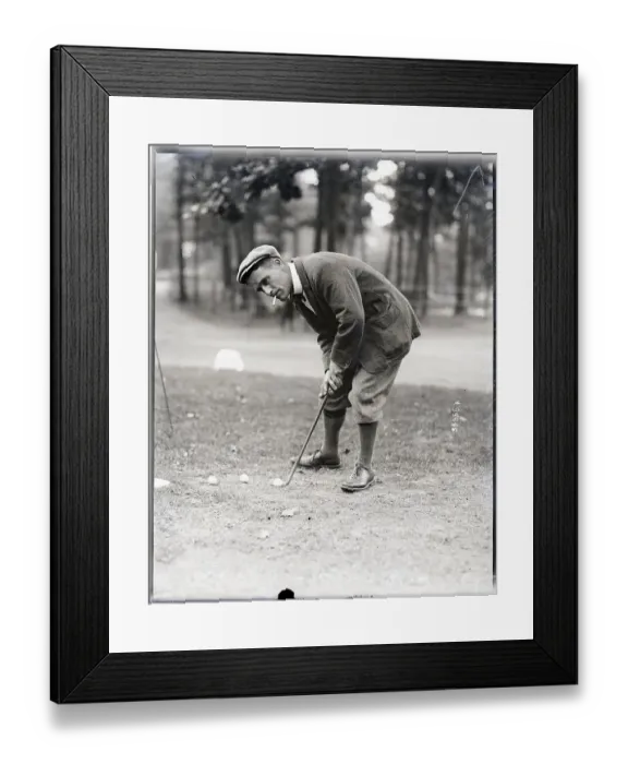 Framed Print : Golfer H. H. Hilton Smokes While Putting