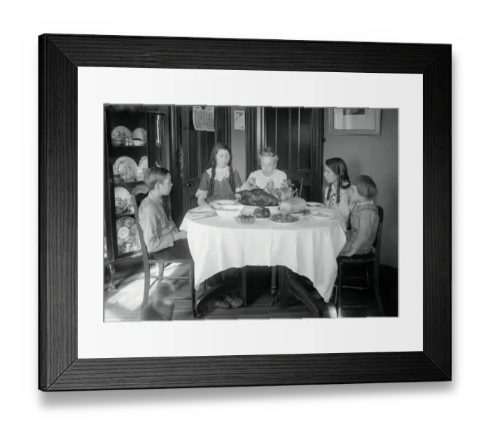 Framed Print : Family Sitting Around Dinner Table Framed Print : Family Sitting Around Dinner Table