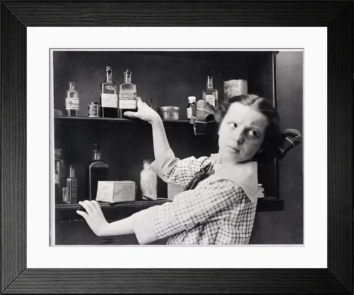 Framed Print : Girl Reaches For Medicine Shelve Framed Print : Girl Reaches For Medicine Shelve
