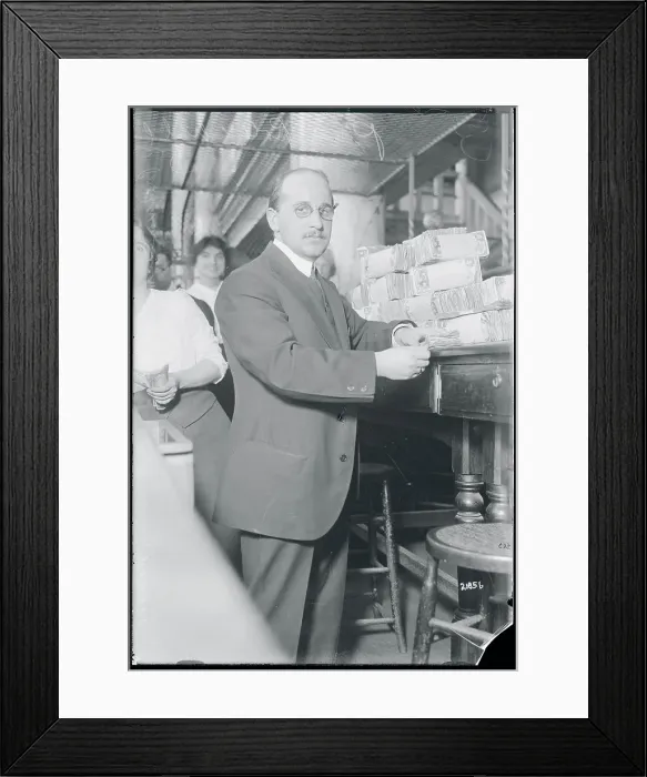 Framed Print : Bank Cashier with Stacks of Bills Framed Print : Bank Cashier with Stacks of Bills