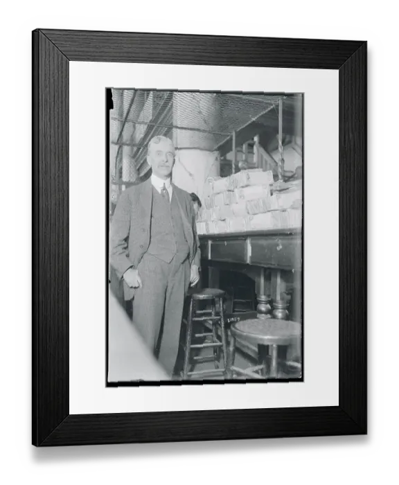 Framed Print : Bank Cashier with Stacks of Bills Framed Print : Bank Cashier with Stacks of Bills