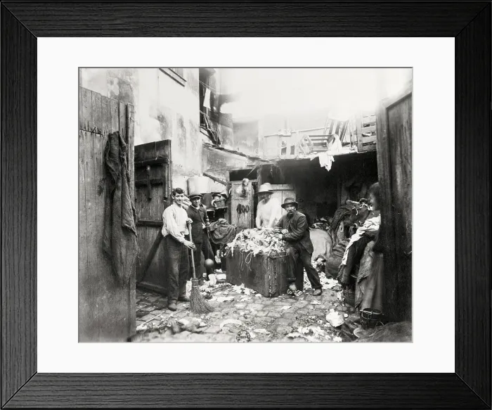 Framed Print : Rag Dealer Posing By Wares In Alley Framed Print : Rag Dealer Posing By Wares In Alley