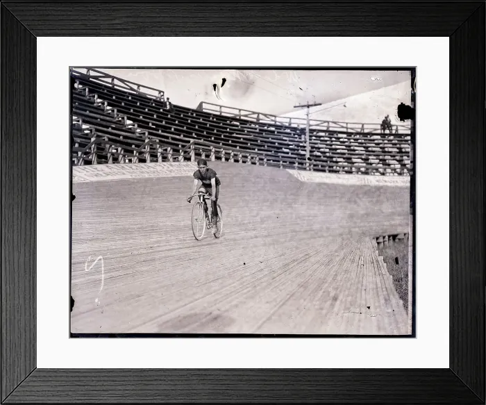 Framed Print : Bicyclist Riding Bike on Track