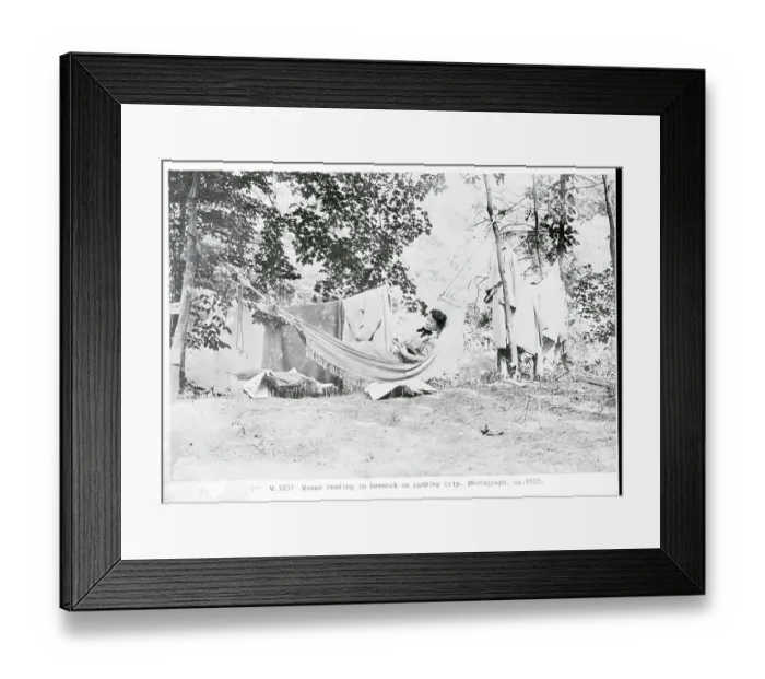 Framed Print : Woman Reading in Hammock During Camping Trip