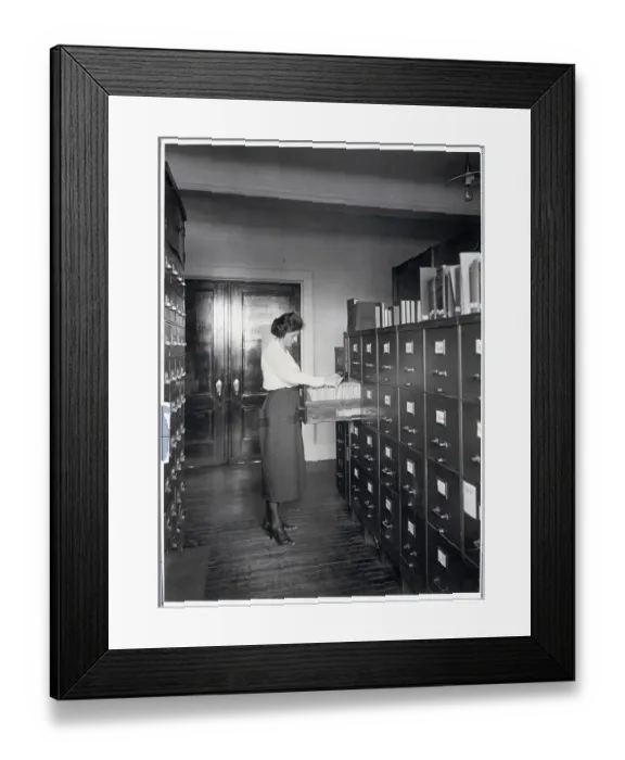 Framed Print : Young Woman Filing Framed Print : Young Woman Filing