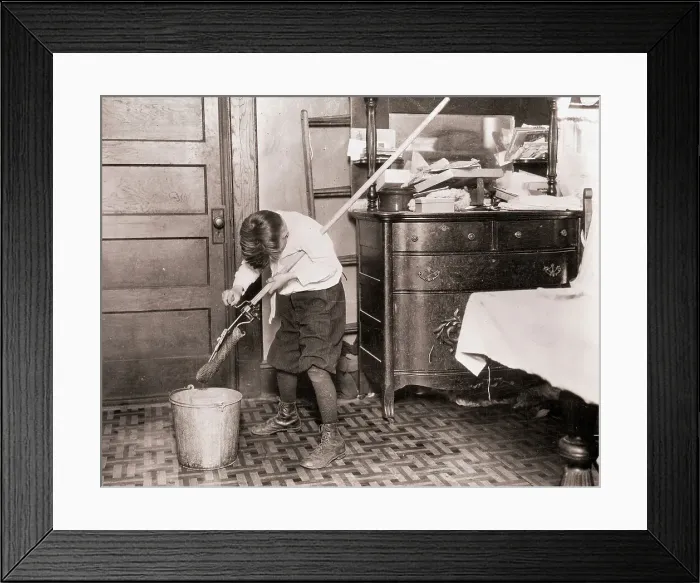 Framed Print : Boy Ringing Out a Mop