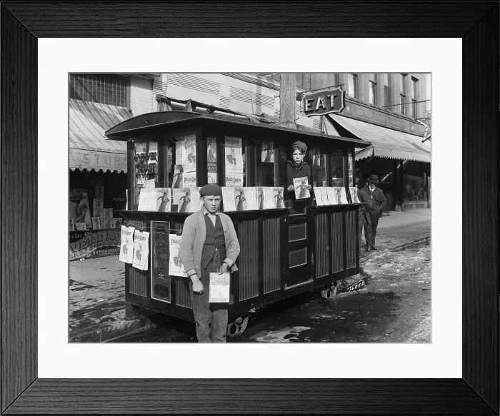 Framed Print : Two Boys Holding Magazines at Newsstand