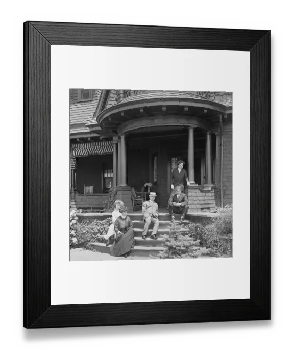 Framed Print : Family Sitting on Porch of Victorian Style House Framed Print : Family Sitting on Porch of Victorian Style House